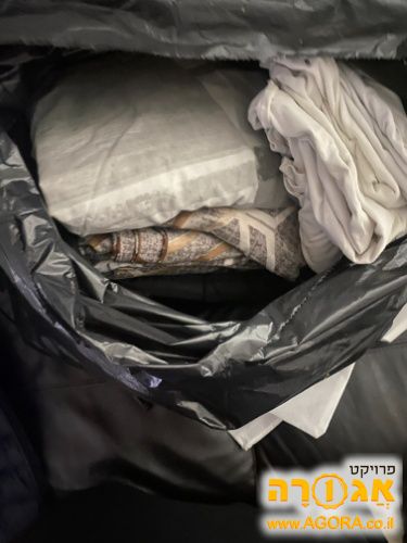 שקית עם סדינים בבית וגן