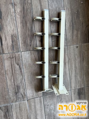 מתקן לתליית כביסה לקיבוע בין קירות
