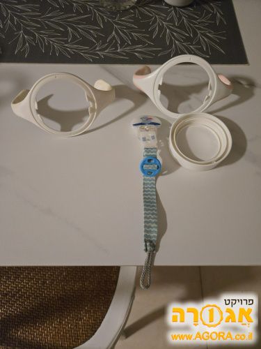 ידיות של טומי טיפי ומכסה, מחזיק מוצץ